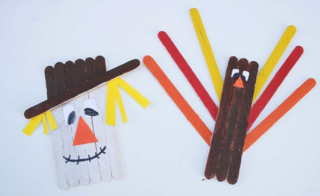popsicle stick craft for autumn - scarecrow and turkey made of craft sticks