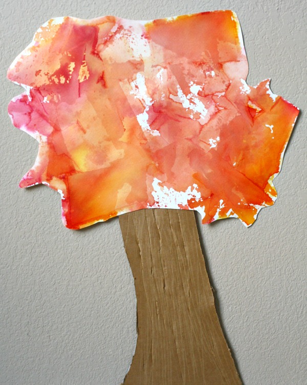 fall tissue paper art from Fantastic fun and learning - tree craft for kids shown with trunk and colorful leaves