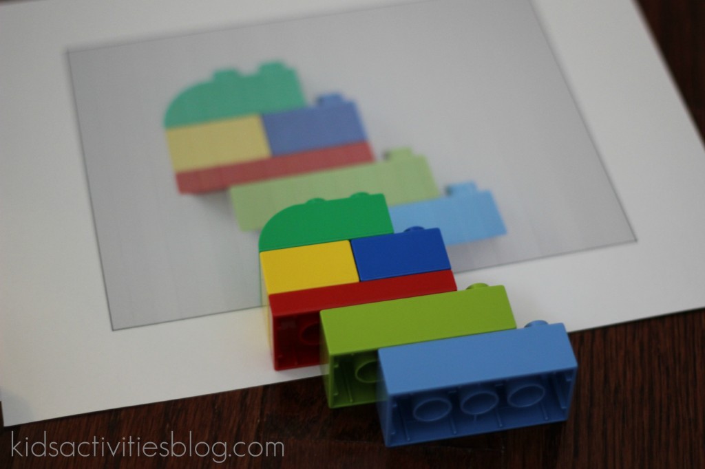 lego building instructions printed out on a printer - step 3 of making your own LEGO instruction booklet from Kids Activities Blog