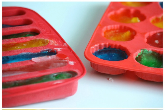 freeze colored water for colored ice play - Kids Activities Blog - ice cube trays filled with colored water frozen