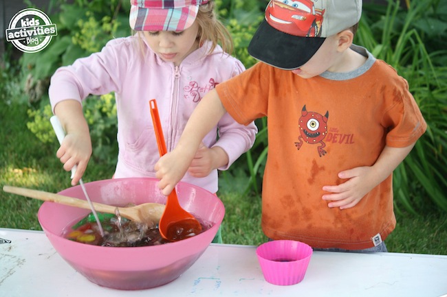 kids playing with coloured ice