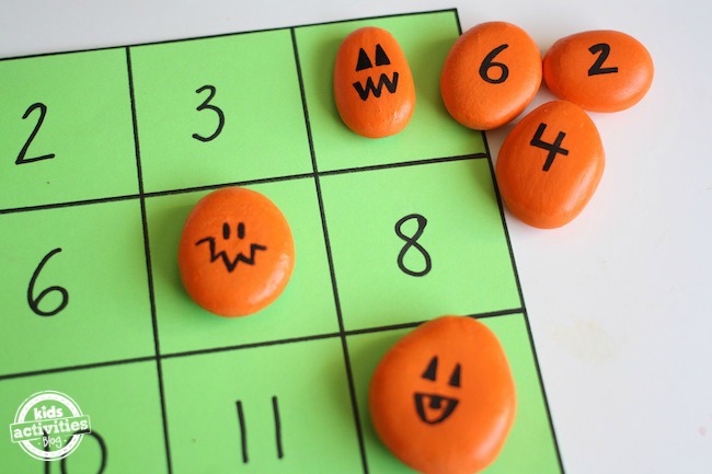 homemade math game with pumpkin rocks
