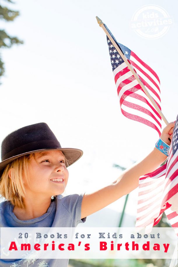 A young girl with a black hat on is holding an American flag in her left hand. 