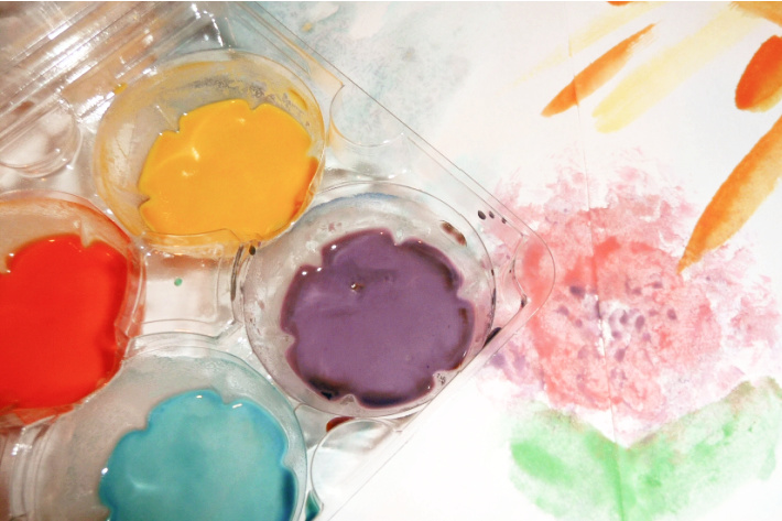 homemade watercolor paint recipe for kids - shown in an egg carton with a painted flower