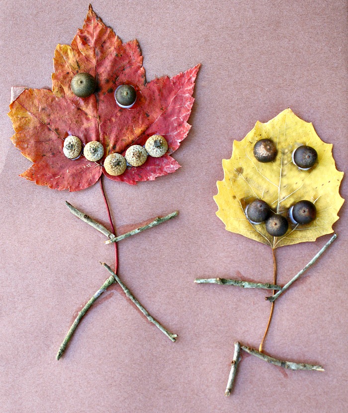 Leaf people craft for kids - two leaves crafted to look like people with stick bodies and acorn eyes from Fantastic Fun and Learning