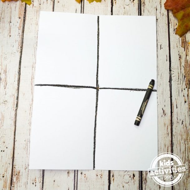 Take your white paper and use a black crayon to break it up in fours to begin this fall art project for toddlers.