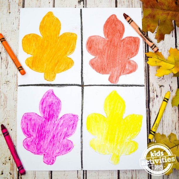 All four leaves are colored in, in this warhol inspire fall leaf project, orange, red, purple, and yellow.