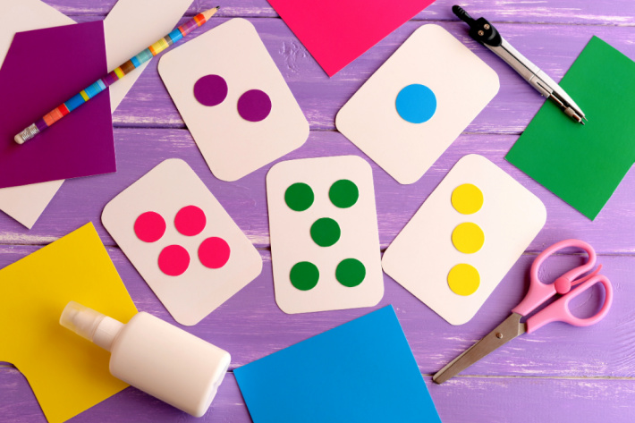 homemade flash card set shown on table with blank playing cards and dot stickers
