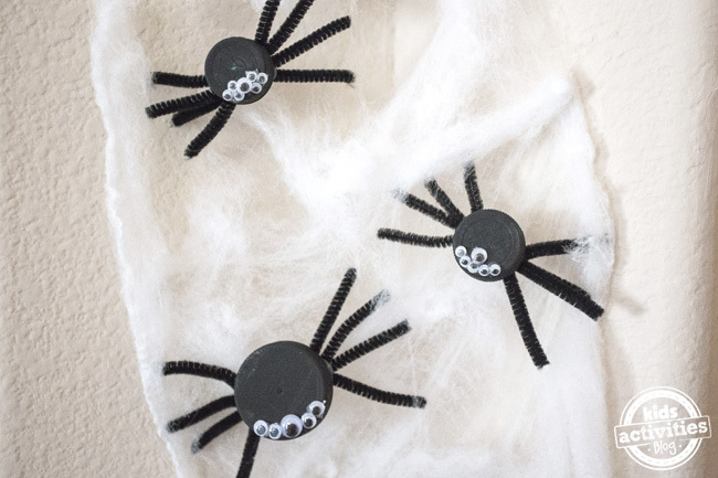 Halloween Bottle Cap Spiders craft for kids - easy Halloween craft idea