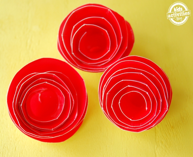 How to make a paper rose easy out of paper plates and are red.