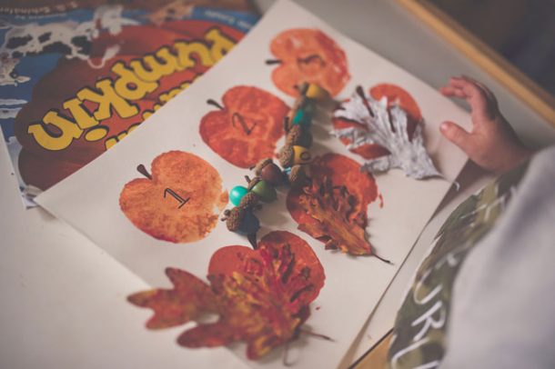 A stack of fall arts and crafts created by a preschooler.