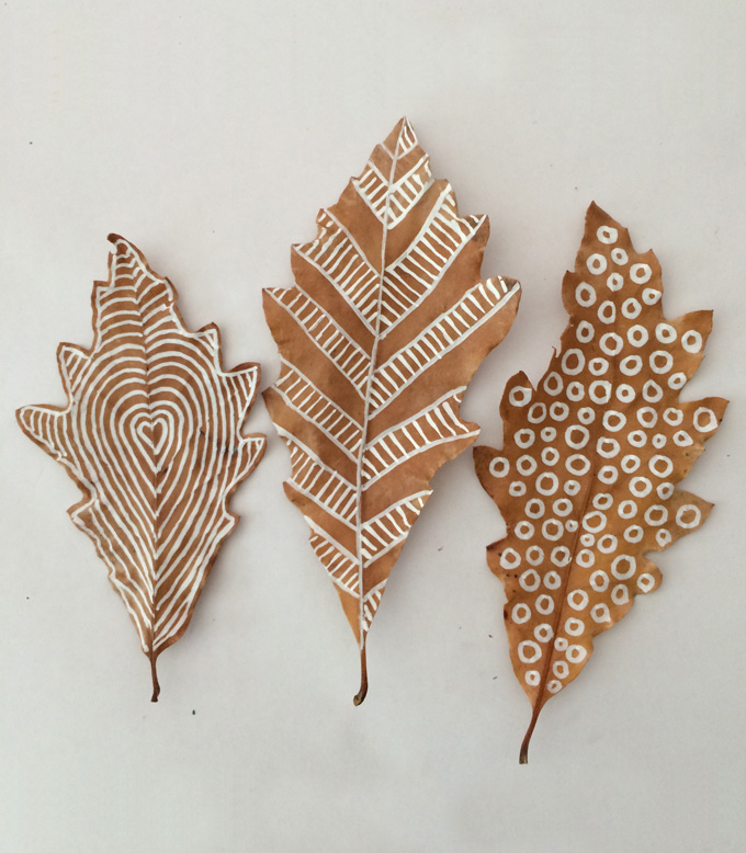 Oak leaves with chalk marker drawings on them - three leaf crafts shown from  Art Bar Blog