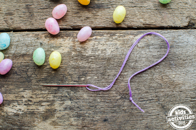 How to make jelly bean bracelets with jelly beans, needle, and thread.