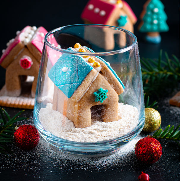 Tiny gingerbread house in a glass