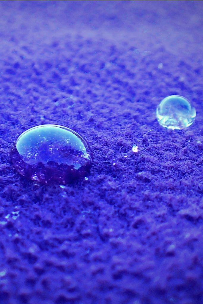 What is surface tension - two droplets of water on purple background - Kids Activities Blog