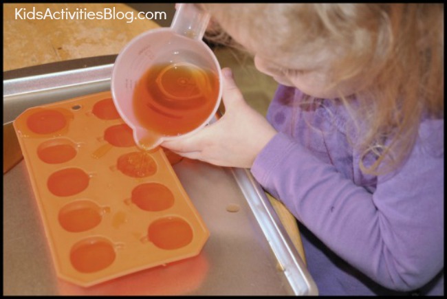 preschool activities for Halloween using orange water and ice trays