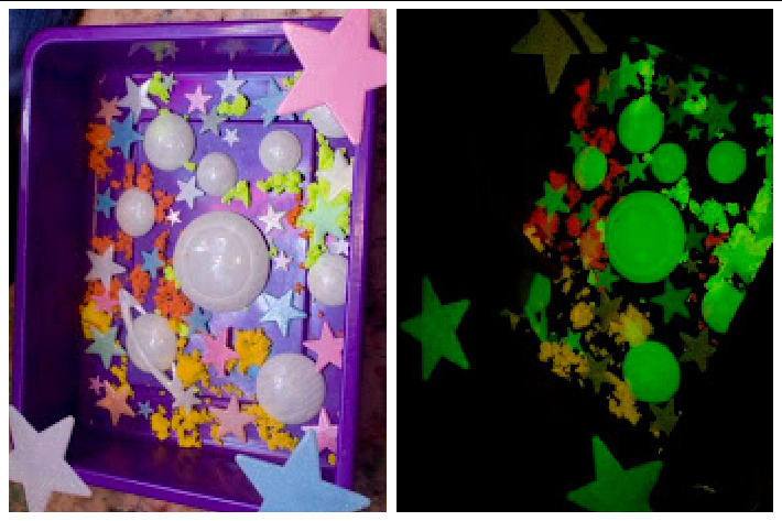 sensory bin that is outer space themed and glows in the dark