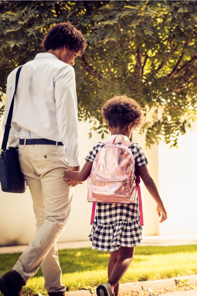 Back to School Traditions to start this year - Kids Activities Blog - parent and child walking to school together