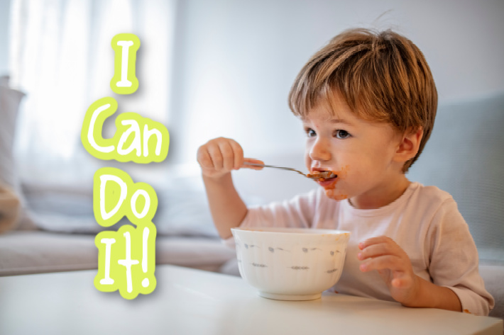 18 month old fine motor skill activities - skill level of feeding himself with a spoon - I can do it - child feeding himself - Kids Activities Blog