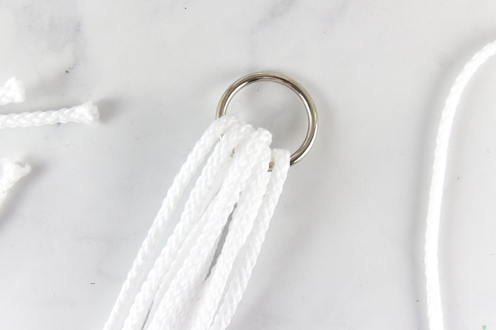 macrame cord folded over a metal ring