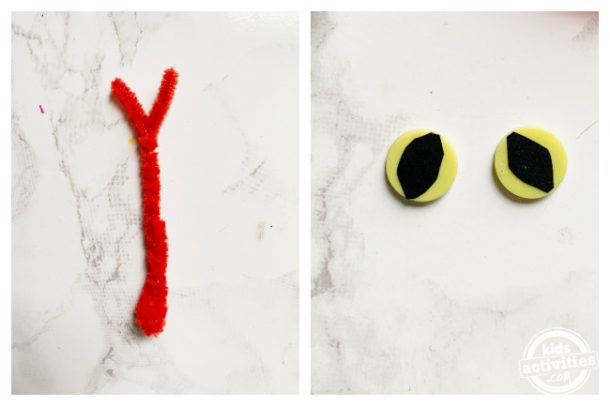 Make snake tongue and snake eyes using pipe cleaner and yellow buttons for paper snake craft