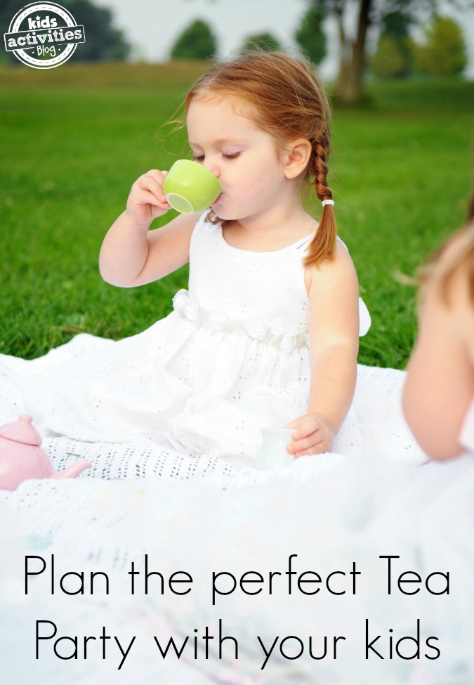 St. Patrick's Day Tea Party With Kids - hosting a green tea party with green food - kids on lawn drinking from green cup
