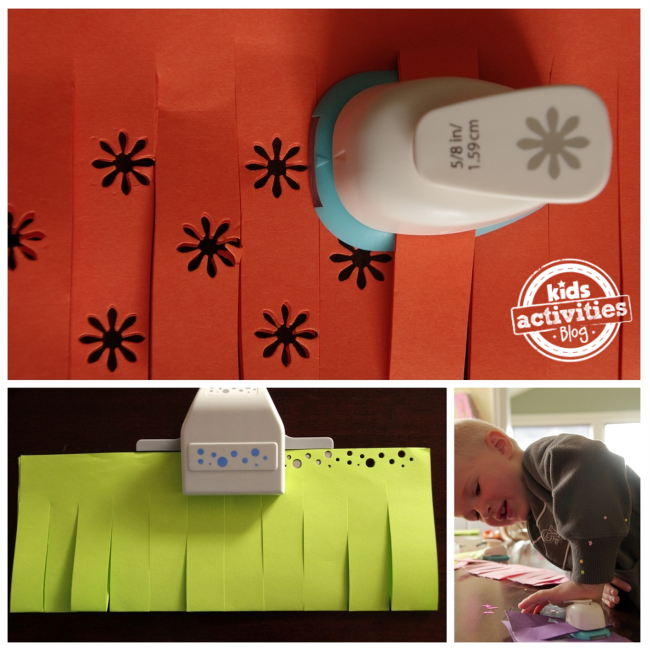 Paper punch making flowers and big and little circles on a orange and green paper lantern.