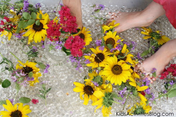 water bead sensory bin wit fresh flowers from Kids Activities Blog