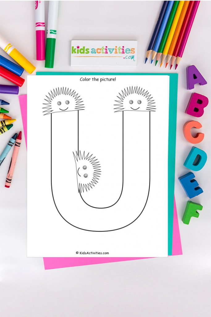 Letter U coloring page Kids Activities Blog - color the picture of the capital letter U surrounded by three urchins on a background of ABCs and crayons colored pencils and markers