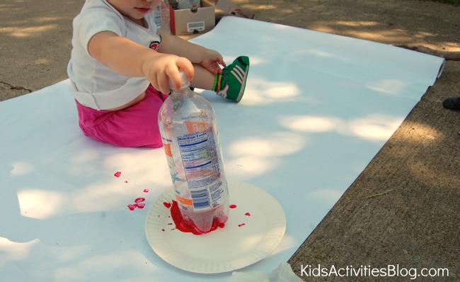 girl making water bottle flowers