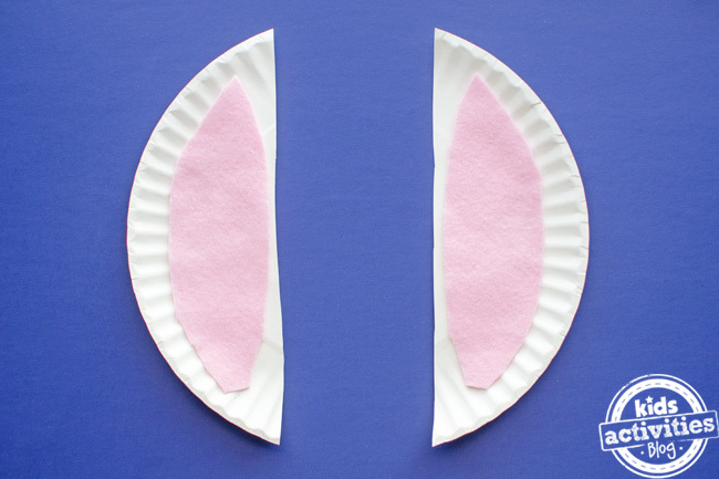 paper plate easter bunny craft - step 2 adding inner ear felt in pink to the rabbit ears.
