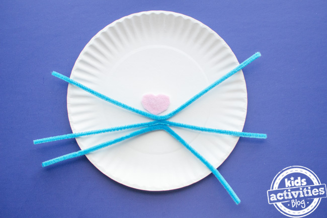 paper plate easter bunny craft step 5 - add the pipe cleaner whiskers and glue in place