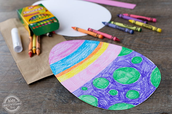 Easter Egg Bags step 3 - glue the decorated egg onto the brown paper lunch bag