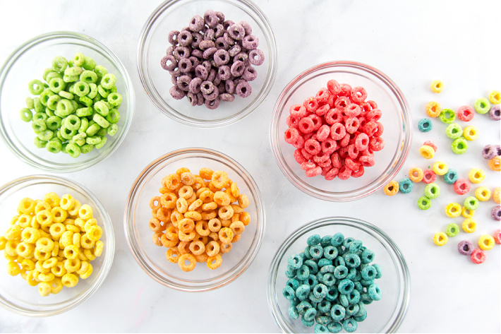 Fruit Loops sorted by color into glass bowls