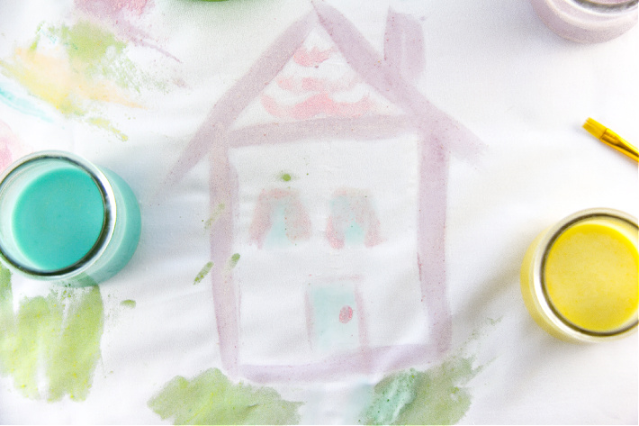 painting a house on fabric with homemade edible fruit loops paint