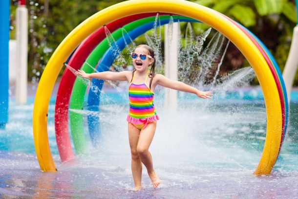 things to do with water like playing at a pool with sprinklers
