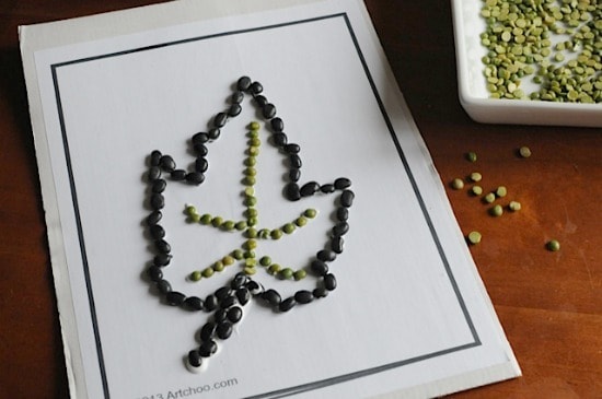 These leaf bean mosaic crafts shown with peas in a bowl and a printing of a leaf outlined with black beans and dried peas