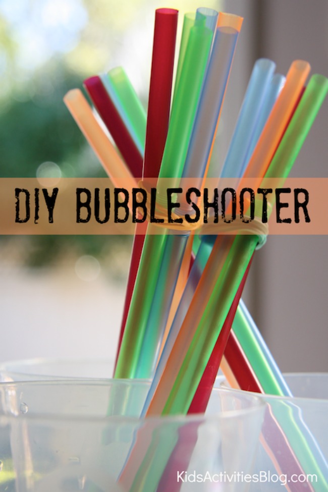 Make your own bubble shooter by kids activities blog - a group of homemade bubble wands (colorful) shown in a series of plastic cups