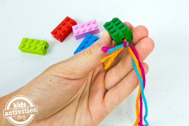 LEGO Bracelet tying off the yarn step 3 - making a LEGO friendship bracelet