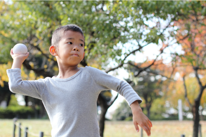 Child throwing ball overhead - arm stability - Kids Activities Blog