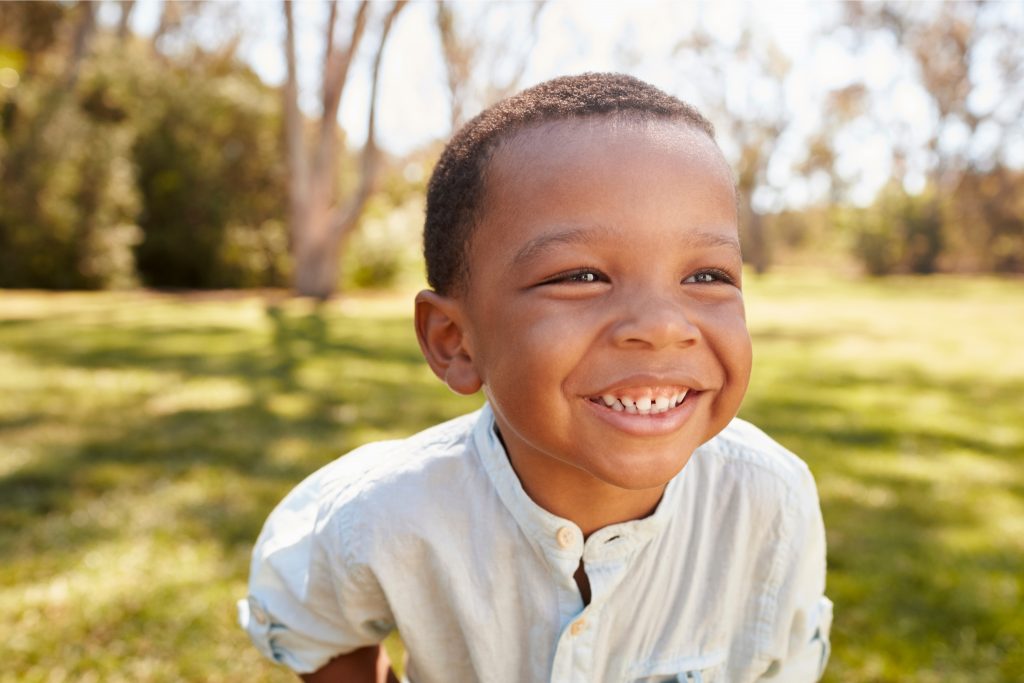 Black History Month Activities for Toddlers preschool and kindergarten - Kids Activities blog - boy laughing outside