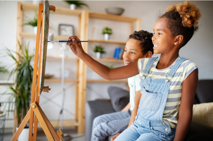 Crafts for every day of Black History Month - Kids Activities Blog - two kids painting at home