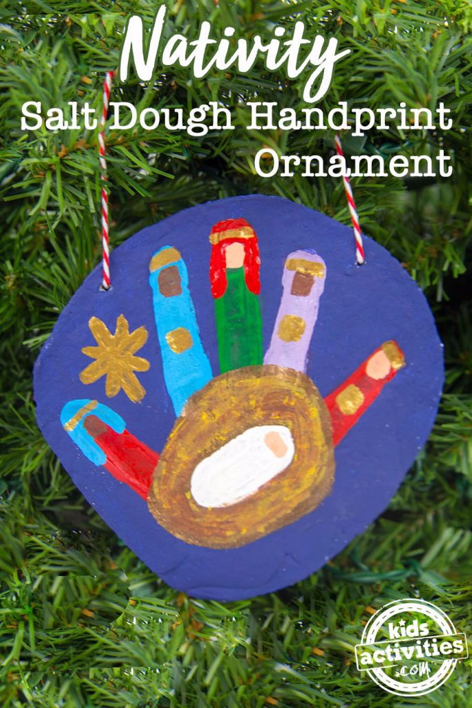 nativity Christmas handprint ornament hanging in a Christmas tree