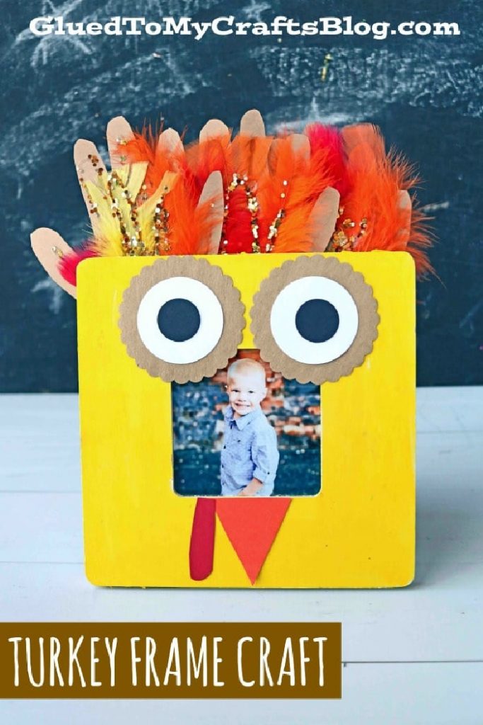 turkey frame craft made of construction paper and handprints with feathers
