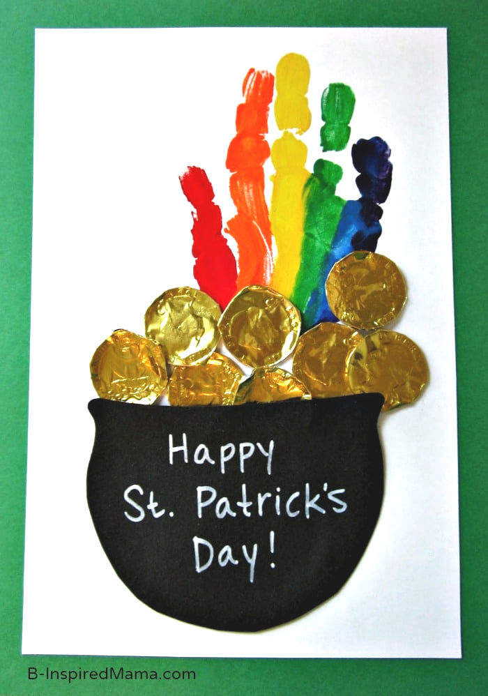 Happy St. Patricks Day with a pot of gold and a handprint rainbow