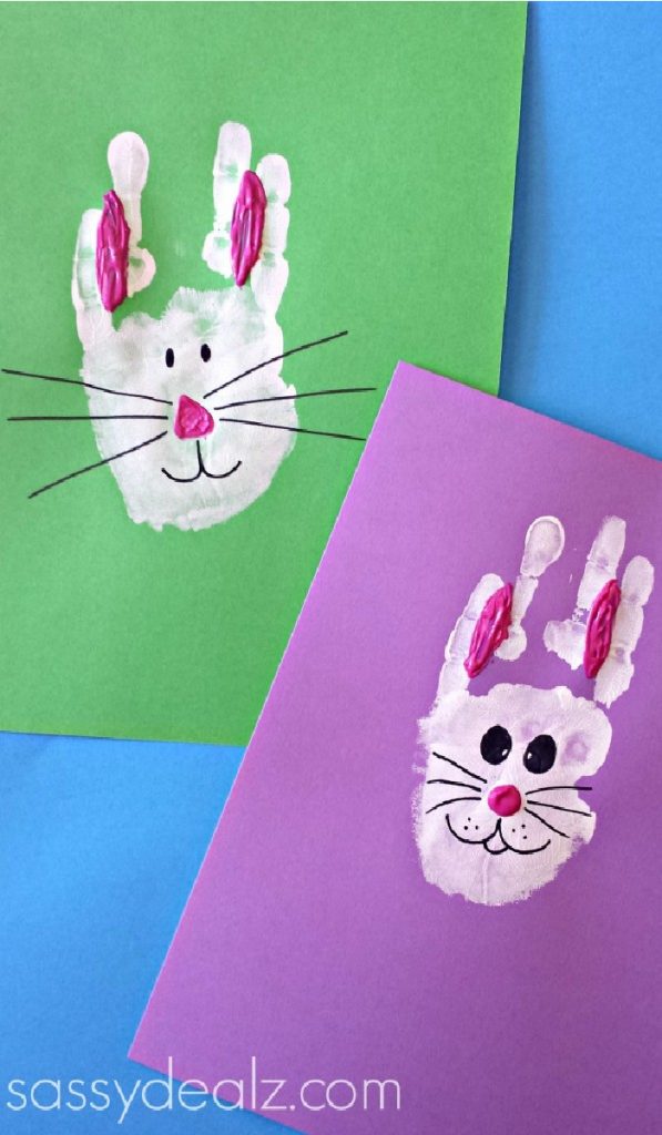 handprint bunny rabbits with pink ears on red and purple paper