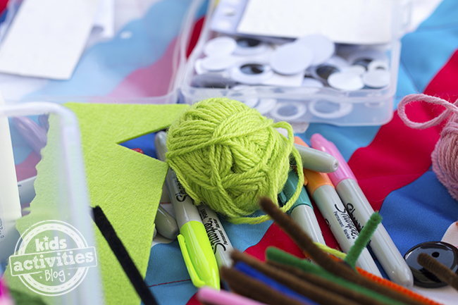 Supplies needed to make this wooden spoon craft like: yarn, markers, felt, googly eyes, glue, buttons, and yarn.