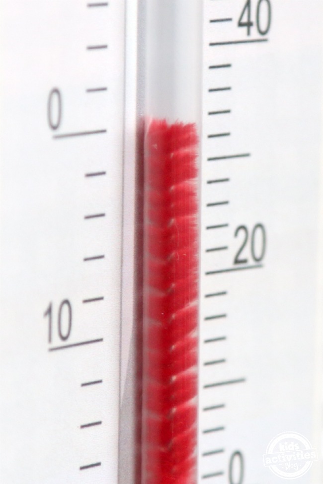 How to Read a Thermometer Printable and Practice - Kids Activities Blog - shown is the completed thermometer craft for kids with clear straw, red pipe cleaner and printable pdf