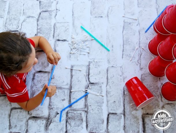 non screen activities like these cup stacking games or pick up straw games.