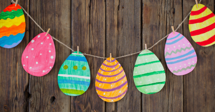 paper Easter egg garland hanging on a wall with colorful paper Easter eggs 